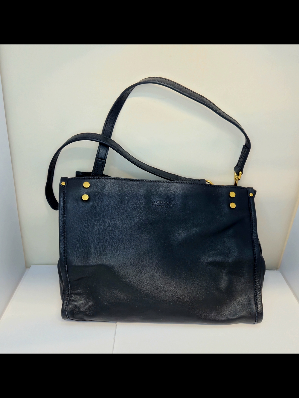 Elegant Black Leather Shoulder Bag with Gold Stud Details